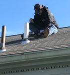 Dryer Vent Tech on Roof